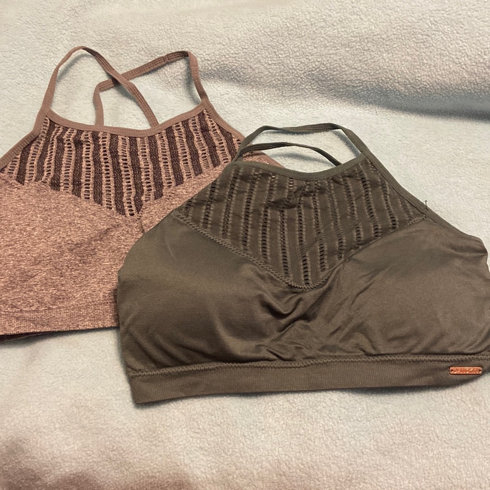 Gray and dark green sports bras cross straps. Size medium